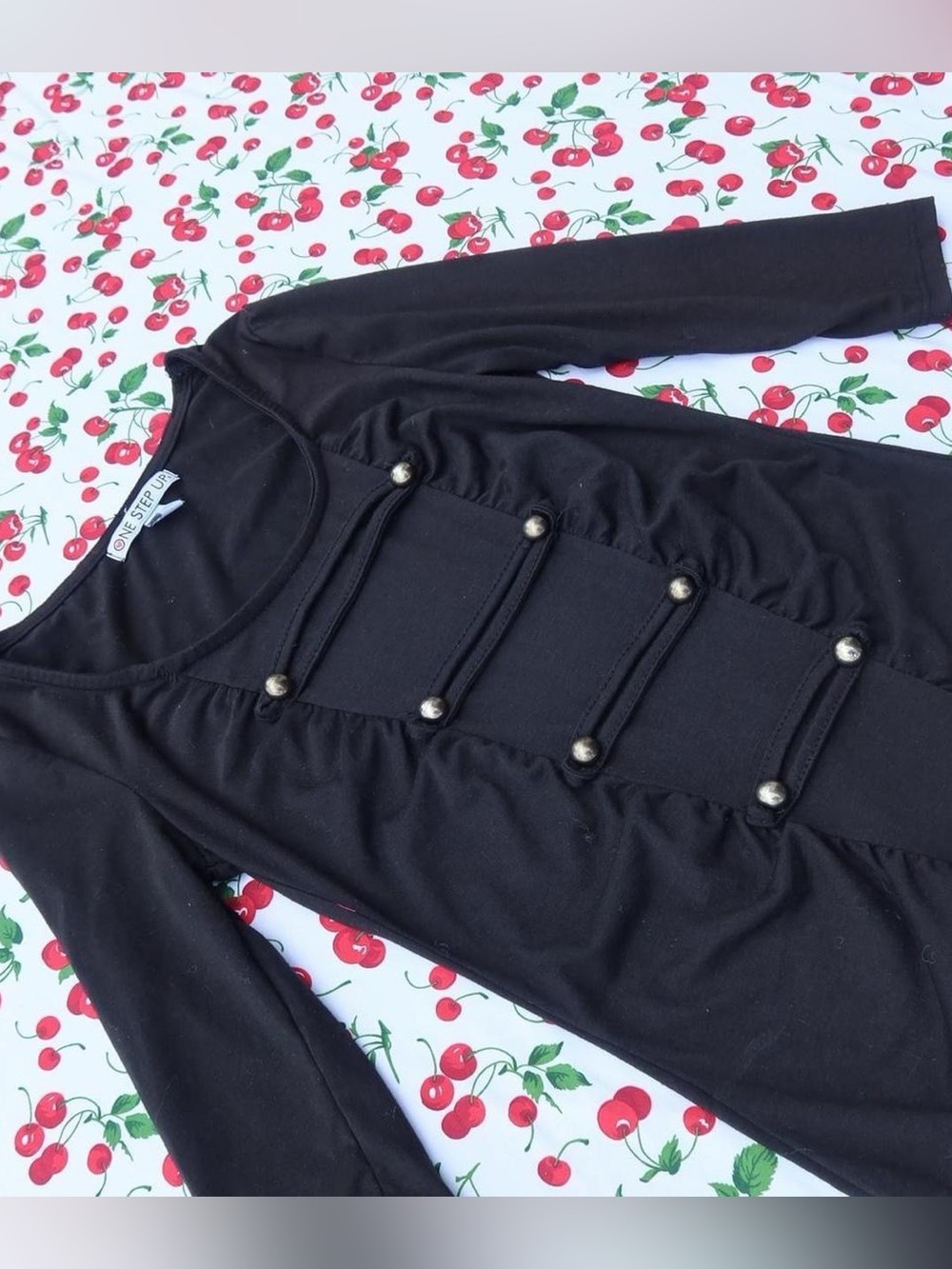 Black, half-sleeve top with military/napolean style buttons